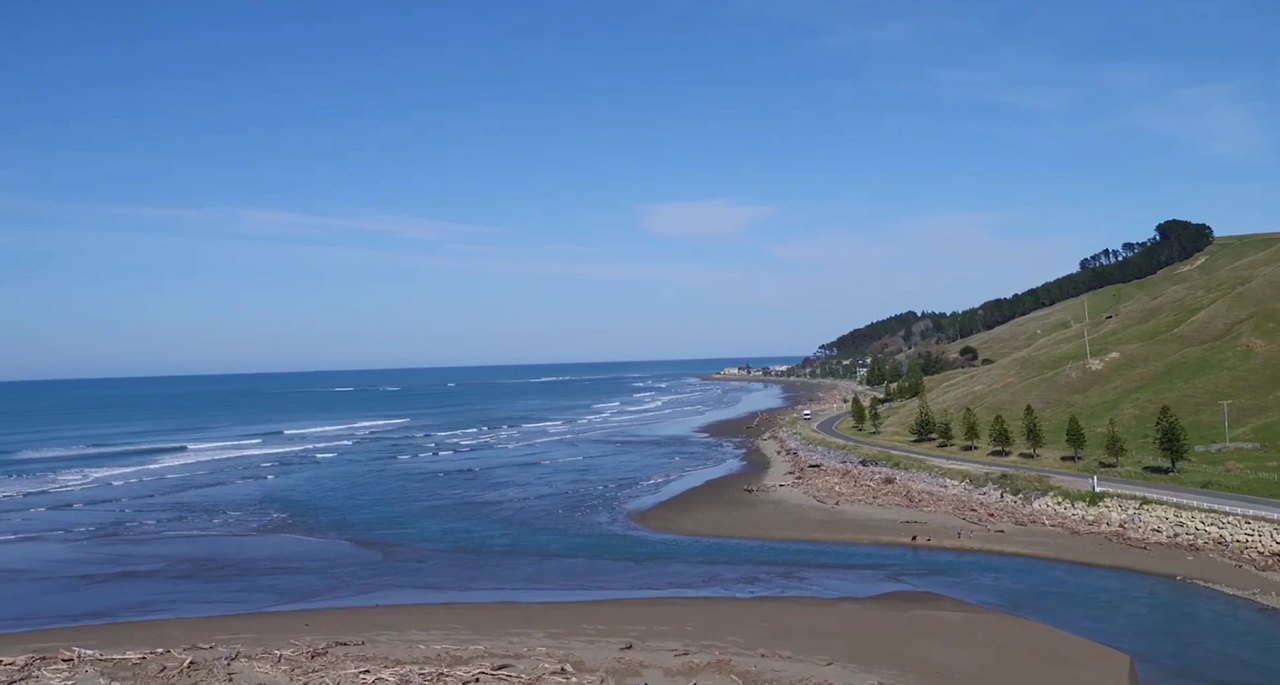 The long sweep of beach and the back road in, Ākitio surf spot, Wellington / Wairarapa, New Zealand.