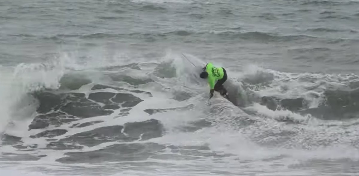 Off the top during a contest at Fitzroy Beach, Fitzroy surf spot, Taranaki / SH45, New Zealand.