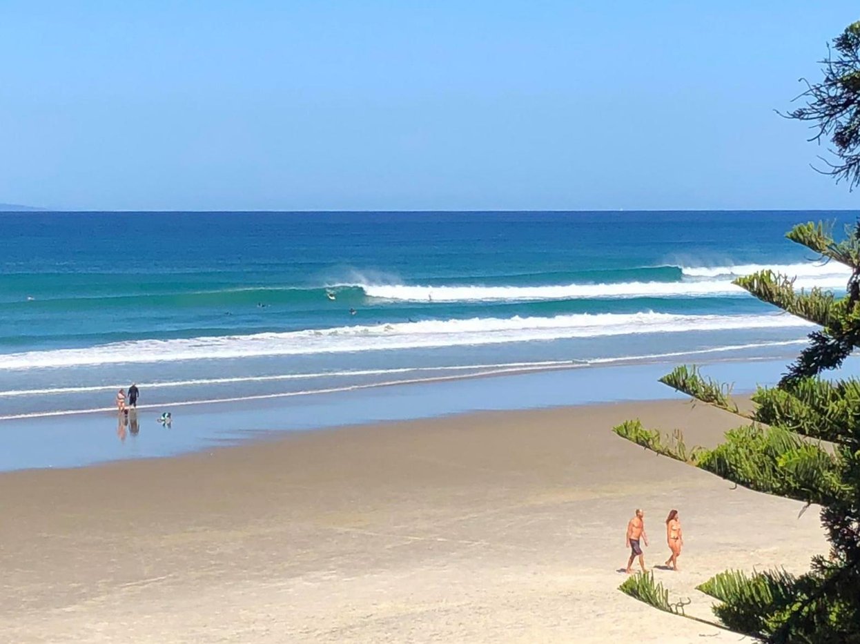 A bright day at Forestry, the everyday beach peaks rolling in, Forestry surf spot, Auckland / Rodney, New Zealand.