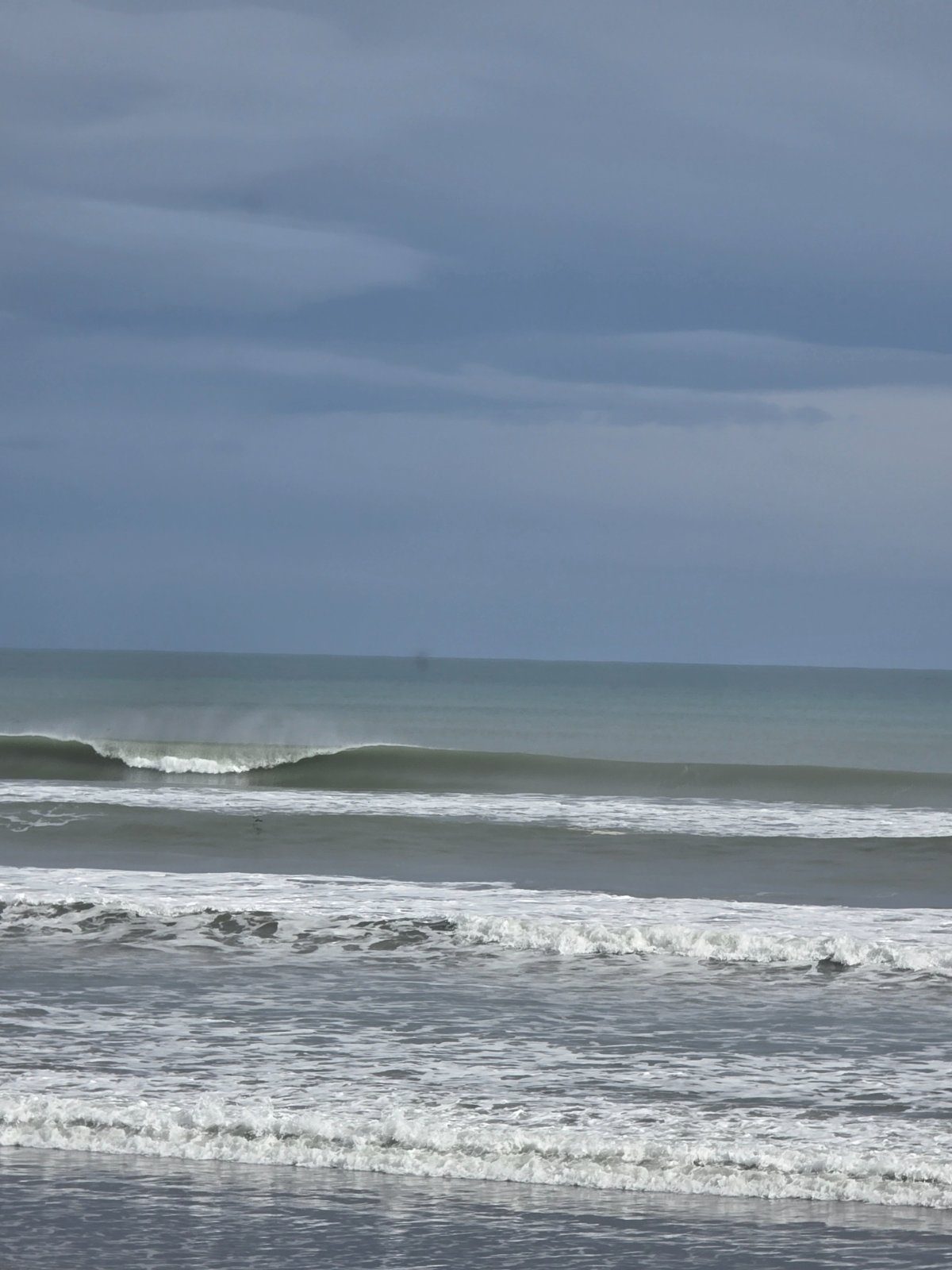 An empty left peeling off the bank, just a clean lull between squalls, Himatangi surf spot, Manawatu / Whanganui, New Zealand