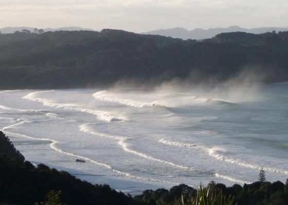 Lines rolling in with mist off the points, classic east-coast Coromandel atmosphere, Hot Water Beach surf spot, Coromandel, N