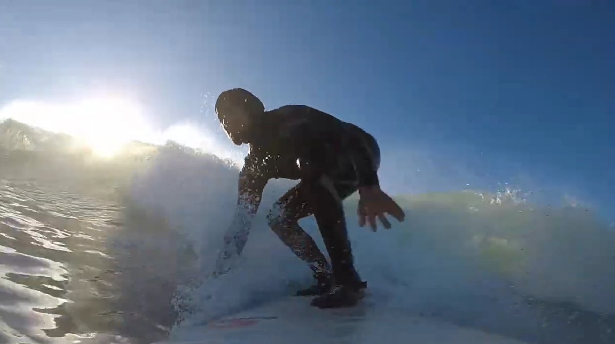 Backlit and dropping in, trading the early sun for an empty wave on this lonely stretch of coast, Kekerengu surf spot, Kaikou