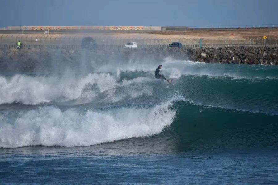 A fresh northerly grooming solid sets off the airport corner, Lyall Bay surf spot, Wellington / Wairarapa, New Zealand.