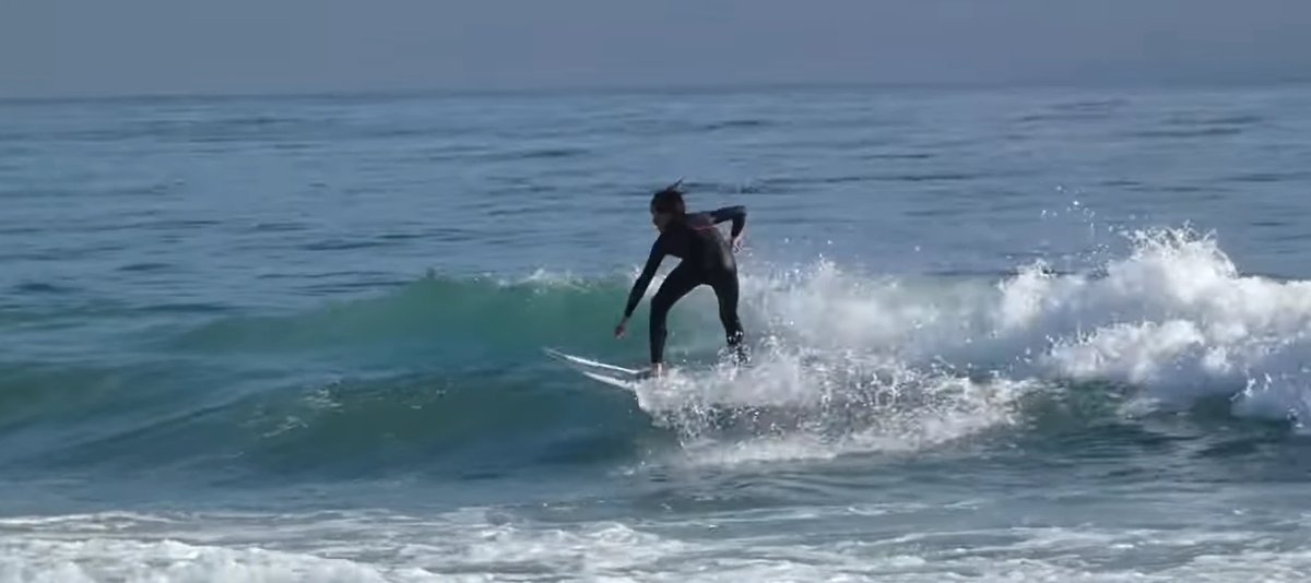 Pulling out of a clean section, wide stance, Mt Maunganui - Tay Street surf spot, Bay of Plenty, New Zealand.