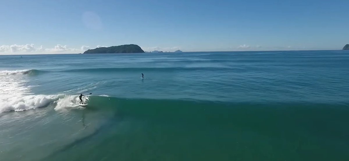 Dawn SUP cruise with the Aldermen Islands on the horizon. The mellow side of the bay, Pauanui surf spot, Coromandel, New Zeal