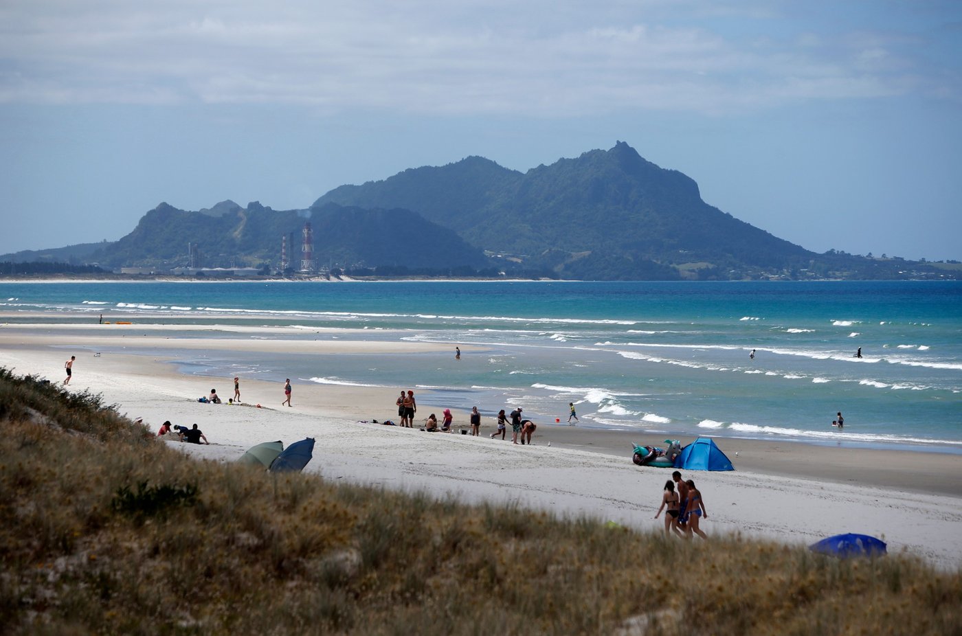 Long beach, Bream Head in the distance, with Marsden Point at the northern end, Ruakākā surf spot, Northland East, New Zealan