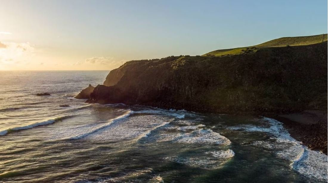 Golden hour at the Ruapuke headland. The slightly south-west-facing coast catches swell when the Raglan points are onshore, R