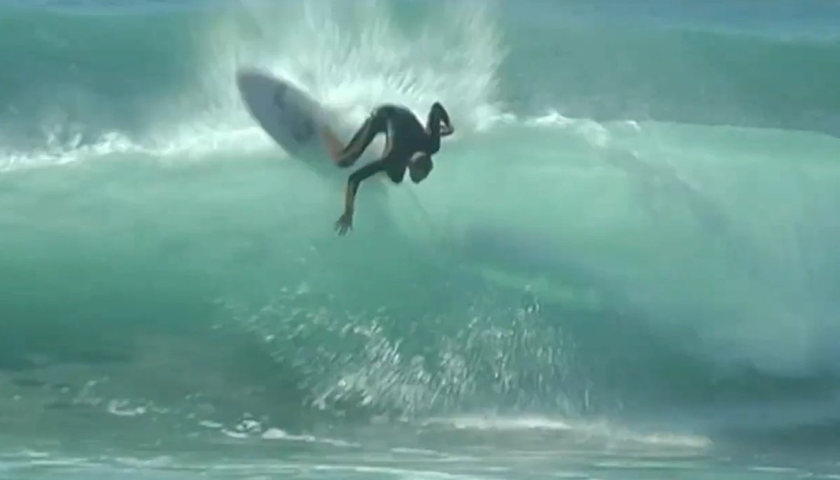 Power turn under the lip on a sunny session, Tairua surf spot, Coromandel, New Zealand.