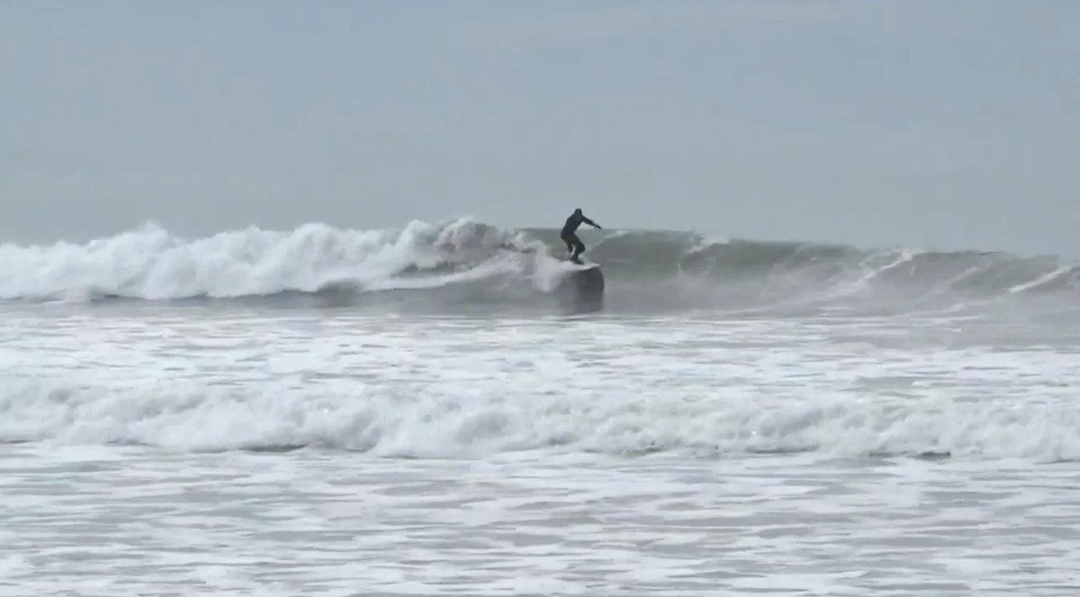 Dropping into a punchy little peak on a soft grey day, the kind of session Waikuku serves up most weekends, Waikuku Beach sur